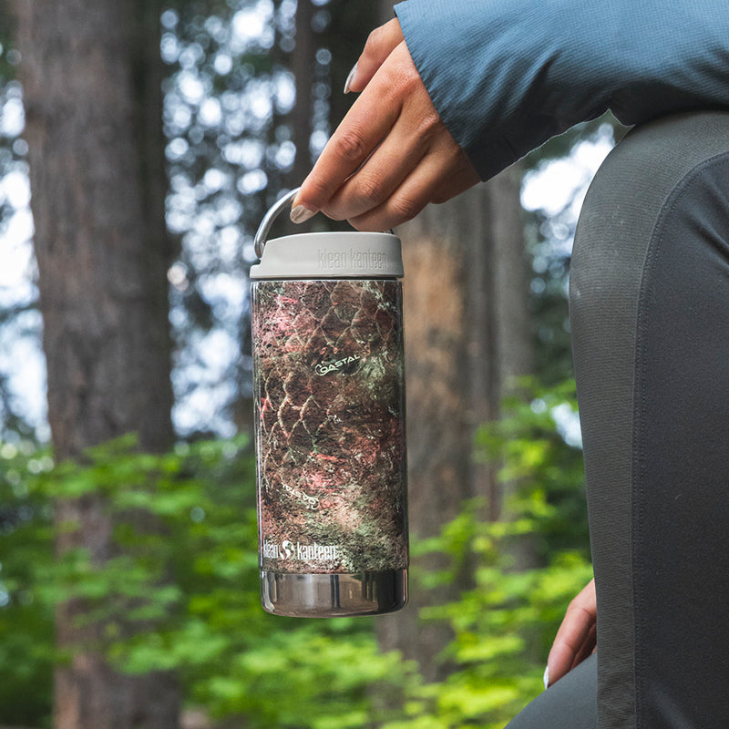 12oz-tkwide-with-twist-cap-mossy-oak-w4 12oz_tumbler_mossyoak_rainbowtrout_hand_closeup_square.jpg