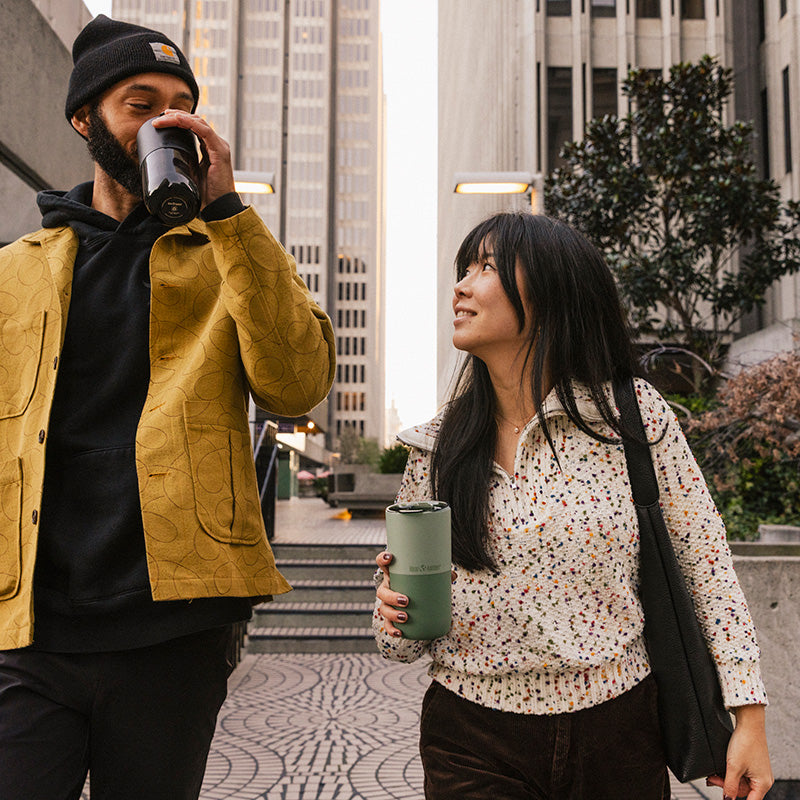 bring-your-own-party-kit-pints-and-tumblers-r7 16oz_rise_tumbler_black_iceberg_couple_drink_city_street_square.jpg
