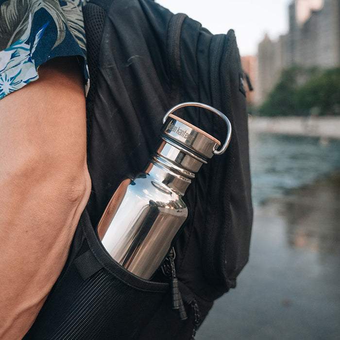 27oz-reflect-with-bamboo-cap-s7 K27SSLRF-MS-BAMBOO_reflect-bottle_backpack_lifestyle.jpg